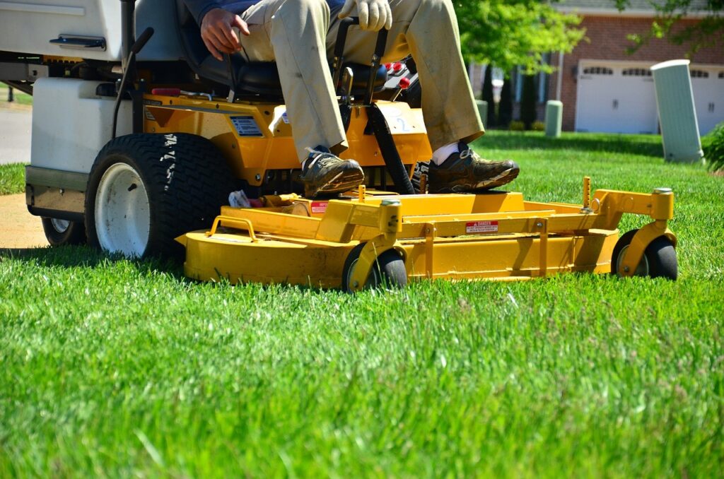 Professional lawn service cutting grass.